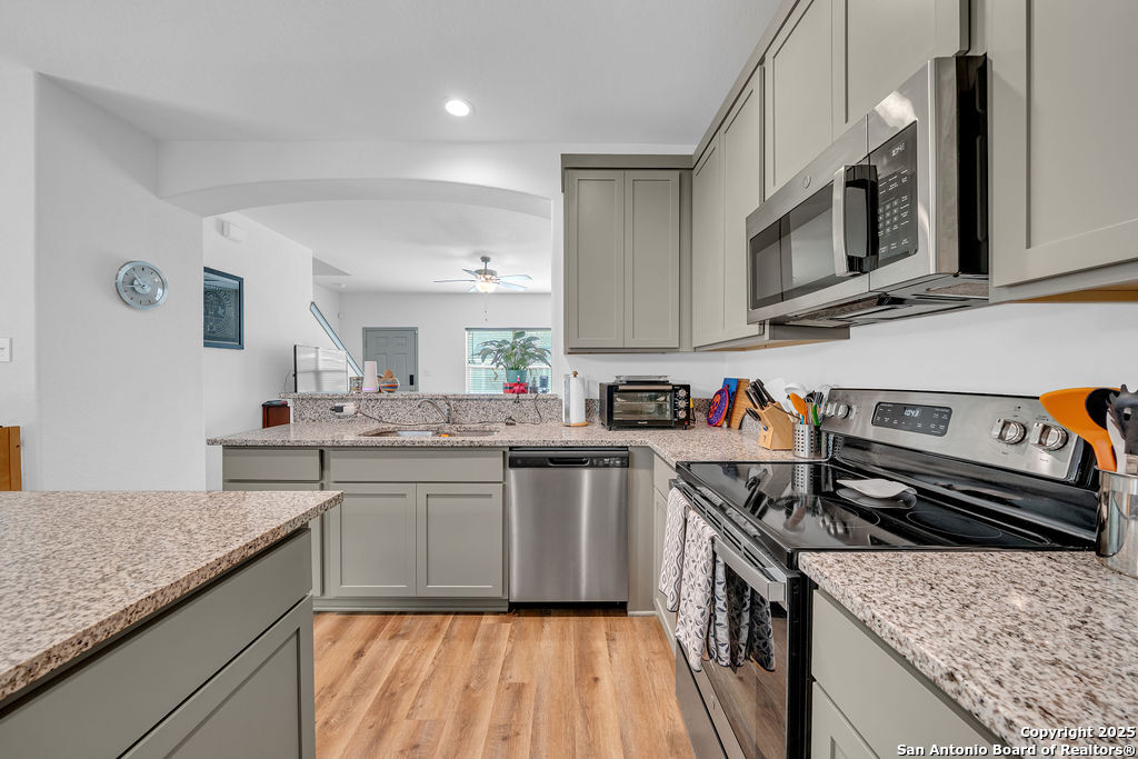2045 Silver Oaks, Unit 18B San Antonio, TX 78213 - Photo 8 of 20 a kitchen with stainless steel appliances granite countertop a stove and a sink