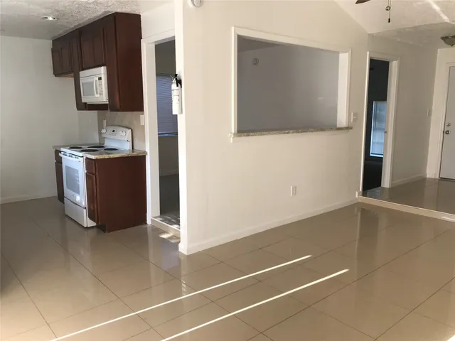 a room with a door and a mirror