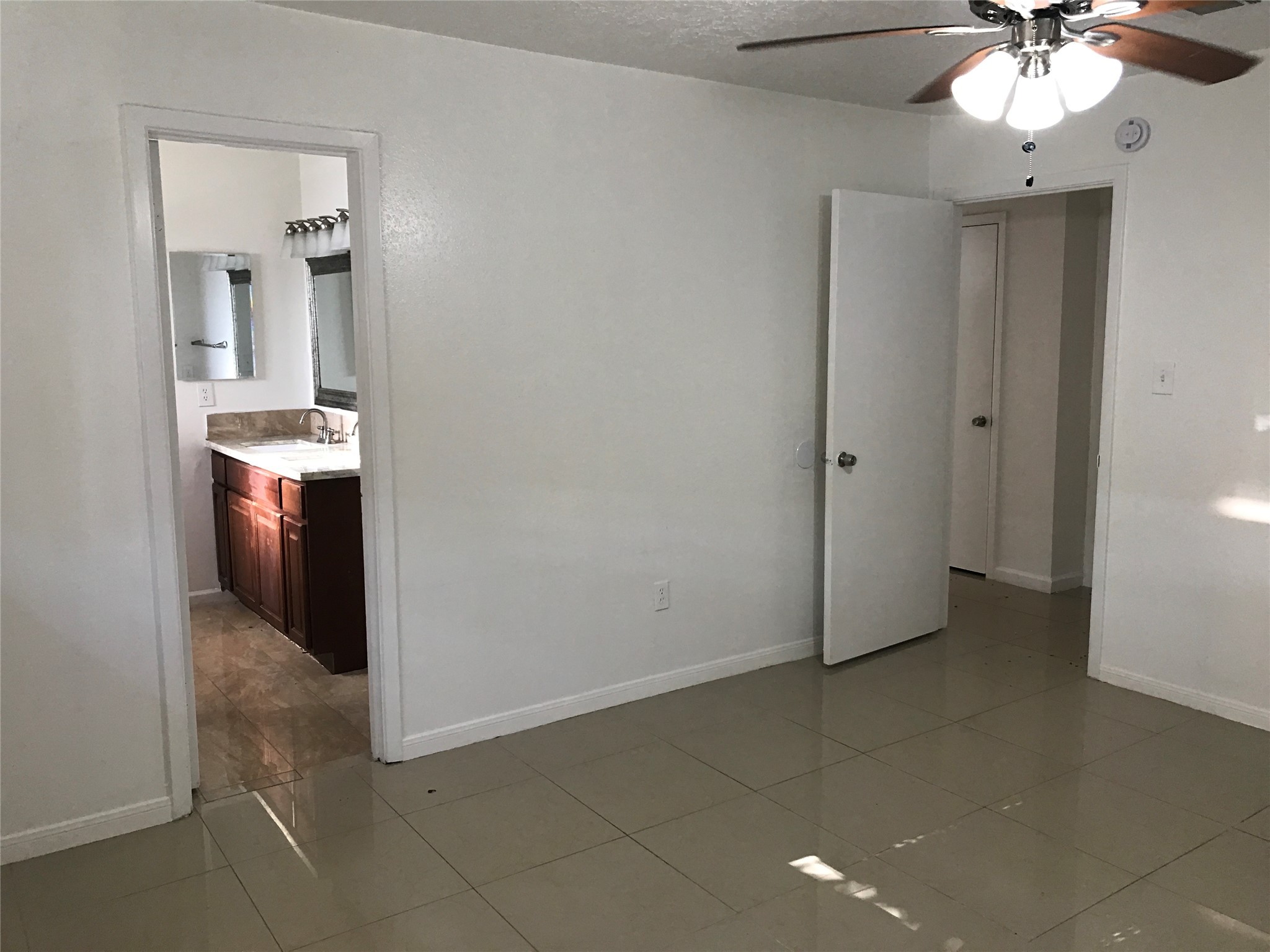 727 Doncrest Street Channelview, TX 77530 - Photo 20 of 40 wooden floor in an empty room with a mirror