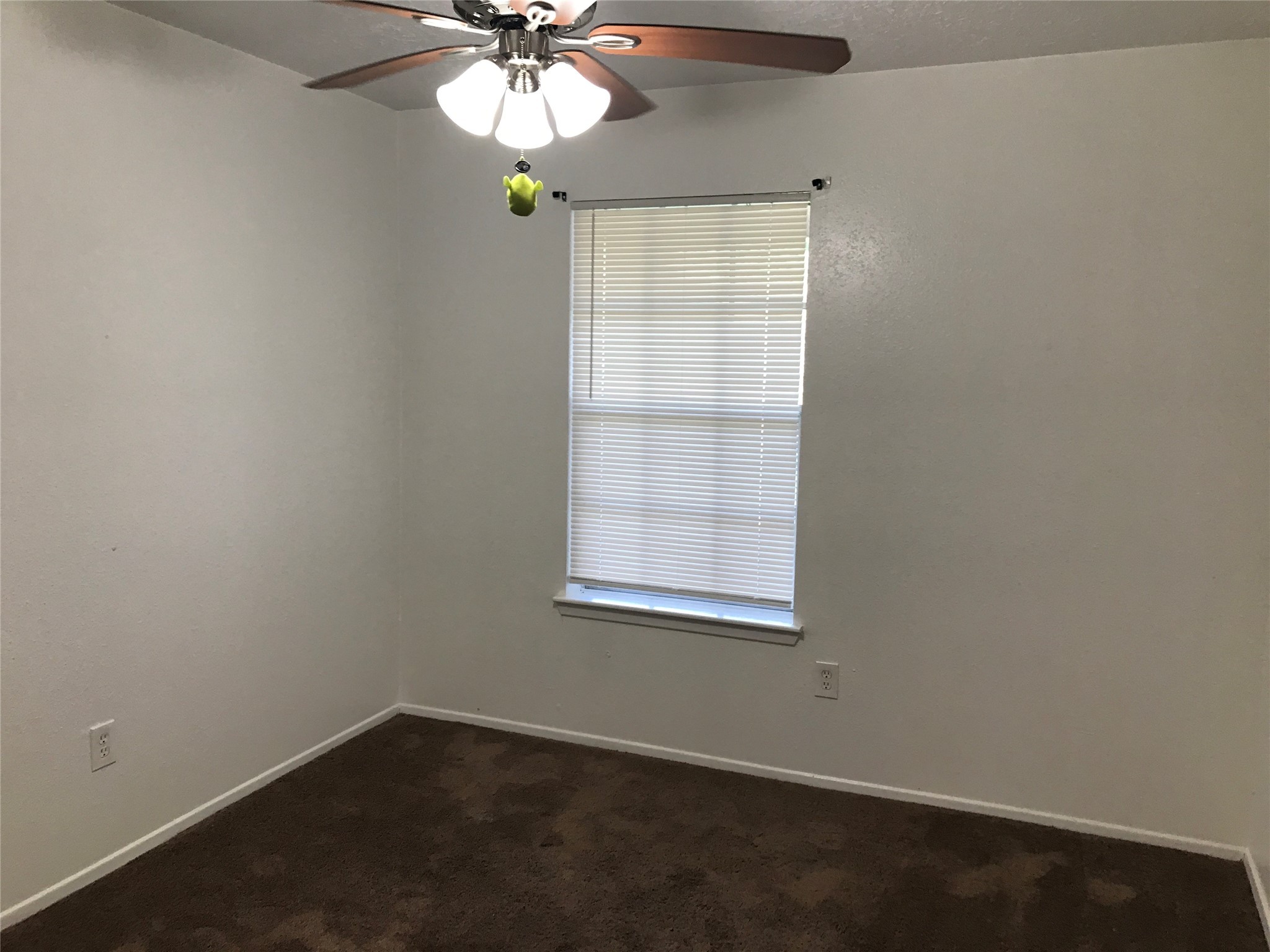 727 Doncrest Street Channelview, TX 77530 - Photo 28 of 40 an empty room with a window and a fan