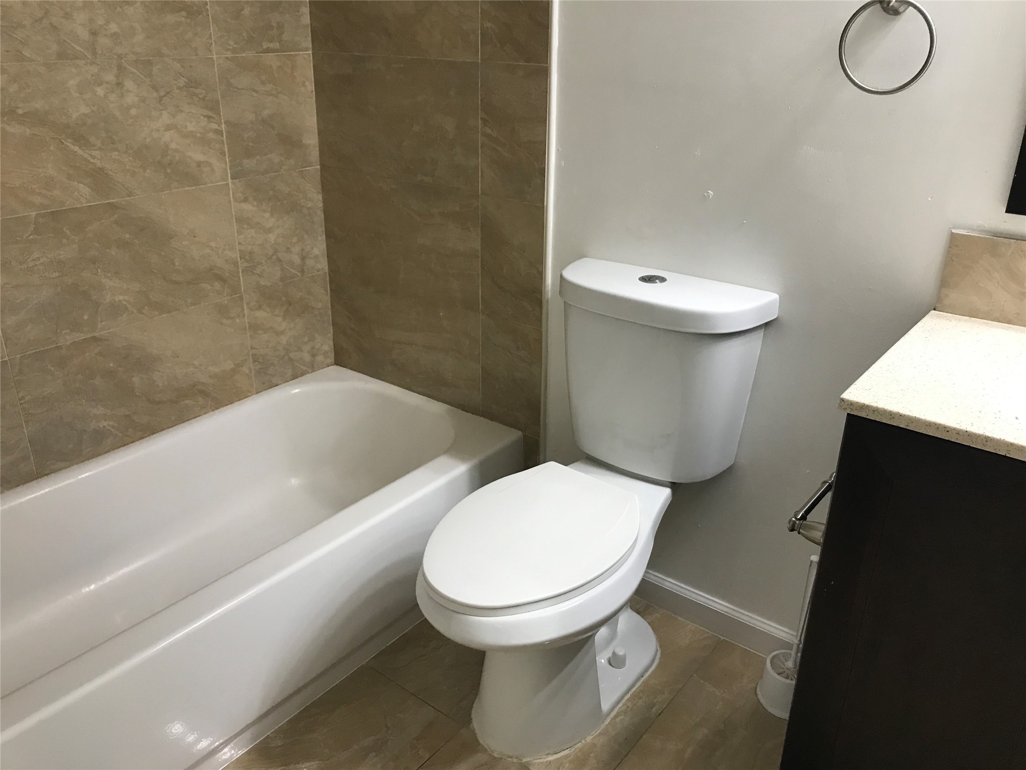 727 Doncrest Street Channelview, TX 77530 - Photo 31 of 40 a white toilet sitting next to a bathroom sink and a tub