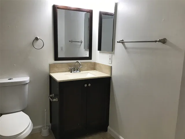 a bathroom with a sink and mirror