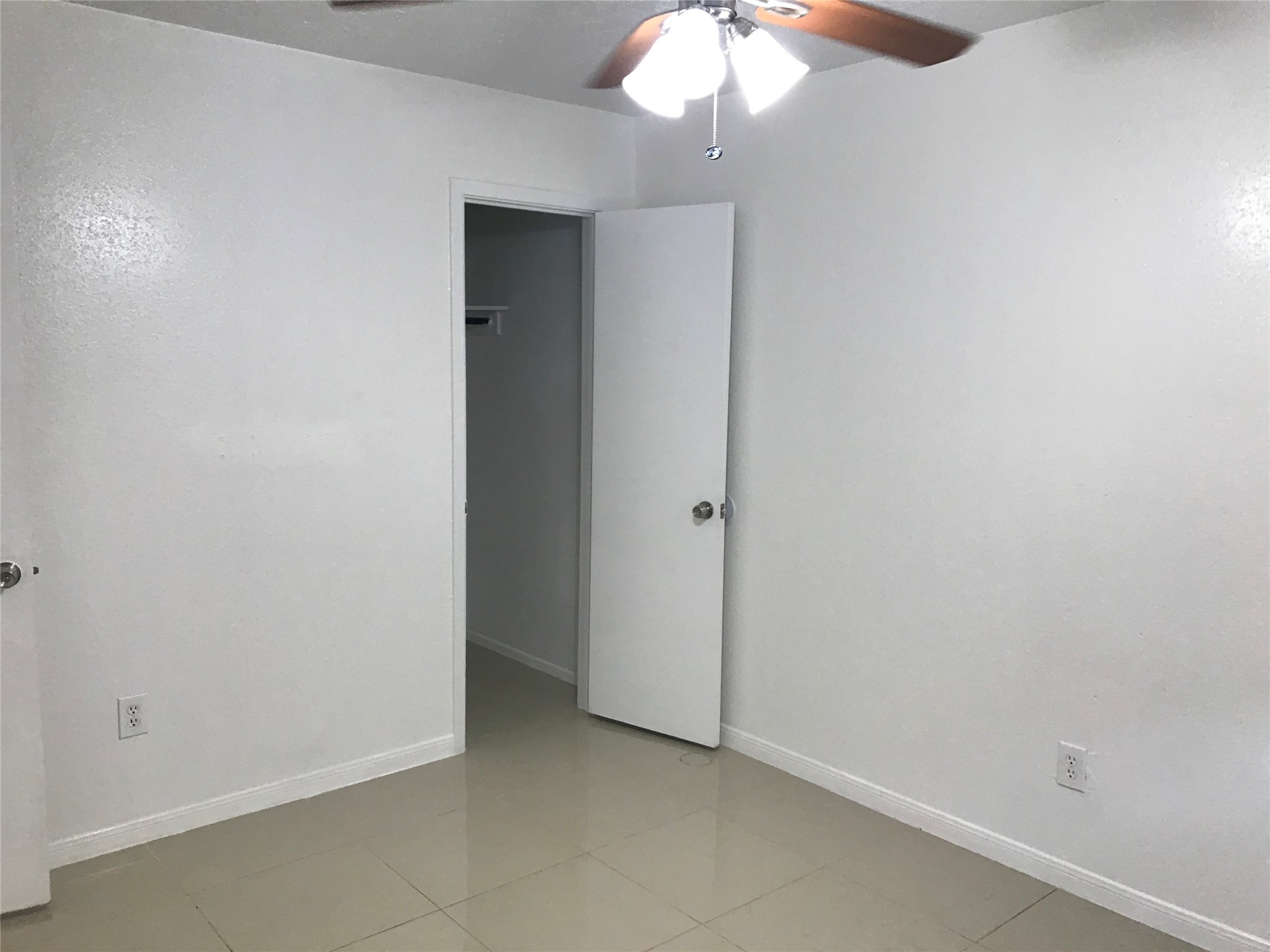 727 Doncrest Street Channelview, TX 77530 - Photo 34 of 40 an empty room with a chandelier fan