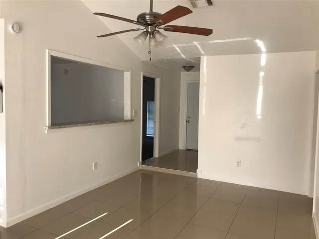 a view of a livingroom with a flat screen tv