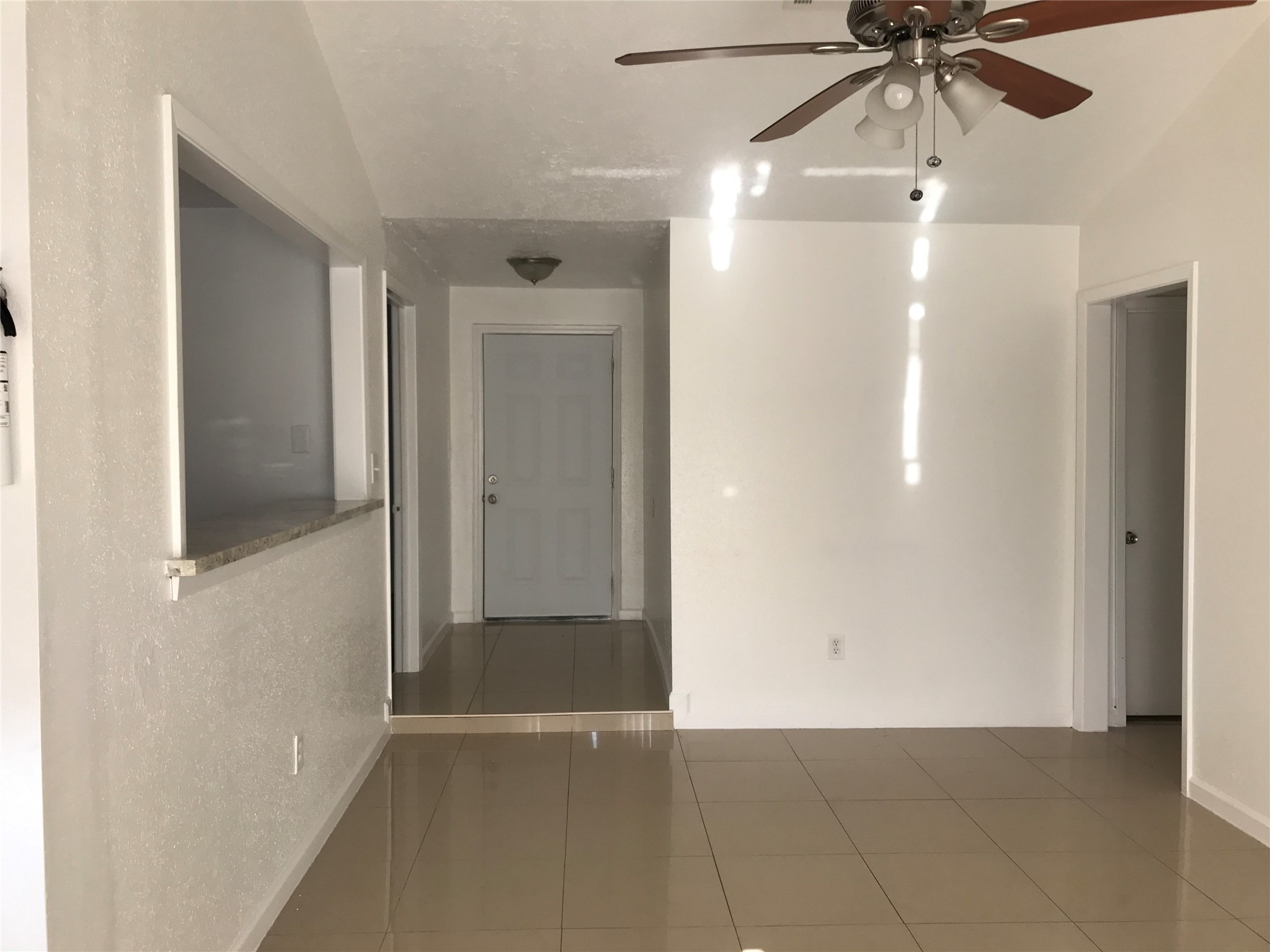 727 Doncrest Street Channelview, TX 77530 - Photo 6 of 40 a view of a hallway with a chandelier fan and entryway