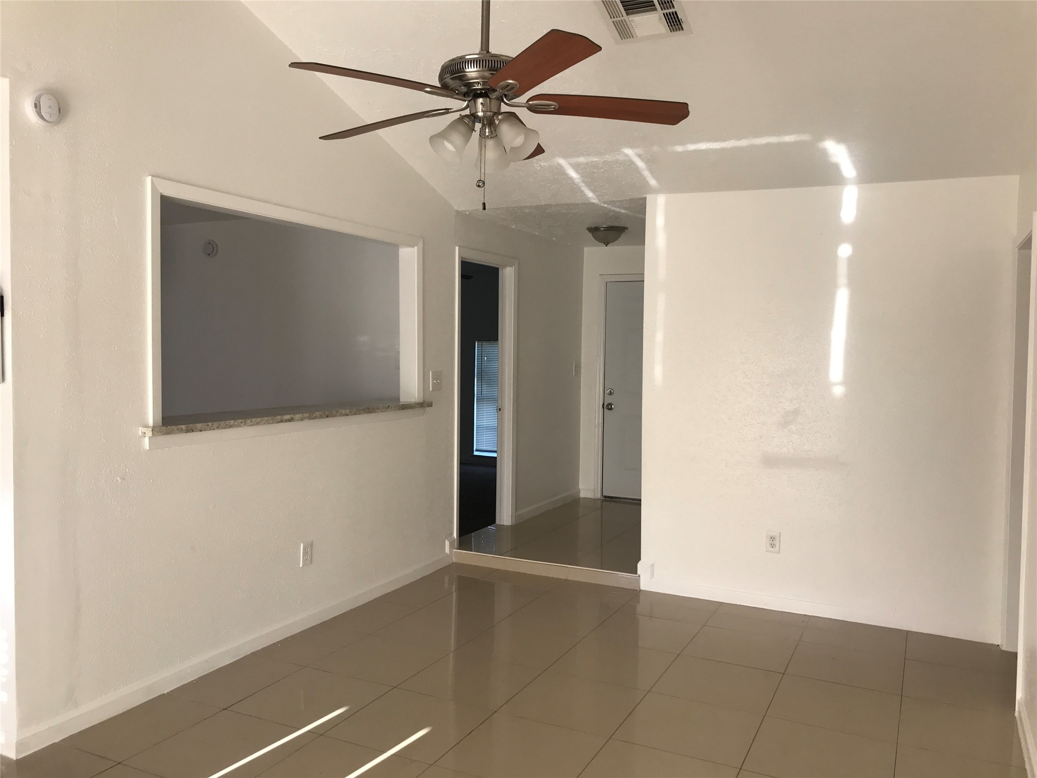727 Doncrest Street Channelview, TX 77530 - Photo 7 of 40 a view of a livingroom with a ceiling fan and wooden floor