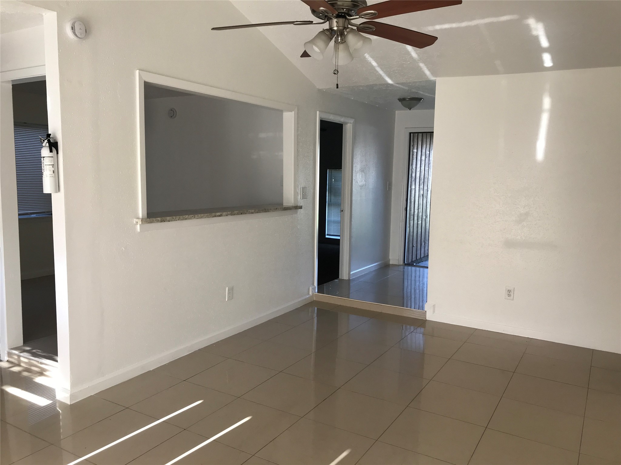 727 Doncrest Street Channelview, TX 77530 - Photo 9 of 40 a view of an empty room with a ceiling fan