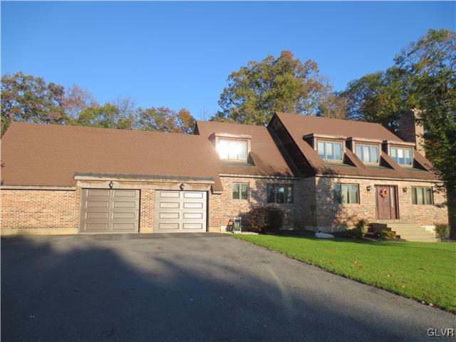 851 Bangor Road Nazareth, PA 18064 - Photo 1 of 49 a front view of a house with a garden and lake view