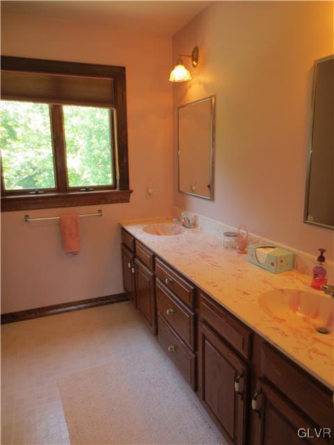 851 Bangor Road Nazareth, PA 18064 - Photo 31 of 49 a bathroom with a granite countertop sink and a mirror