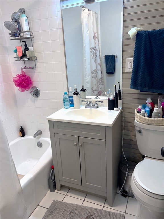 167 M Street, Unit 3F Boston, MA 02127 - Photo 6 of 7 a bathroom with a sink toilet and mirror