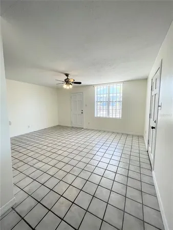 a view of an empty room and window
