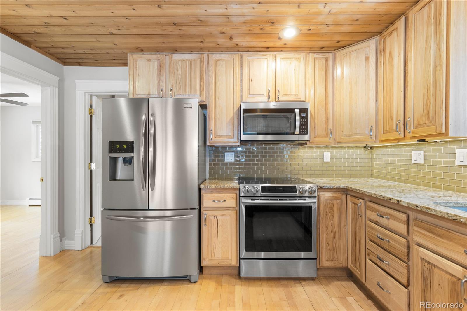 10684 Beas Drive Conifer, CO 80433 - Photo 11 of 38 a kitchen with appliances a sink and a window