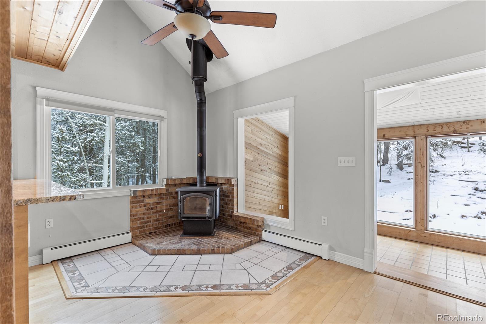 10684 Beas Drive Conifer, CO 80433 - Photo 13 of 38 a living room with furniture and a large window