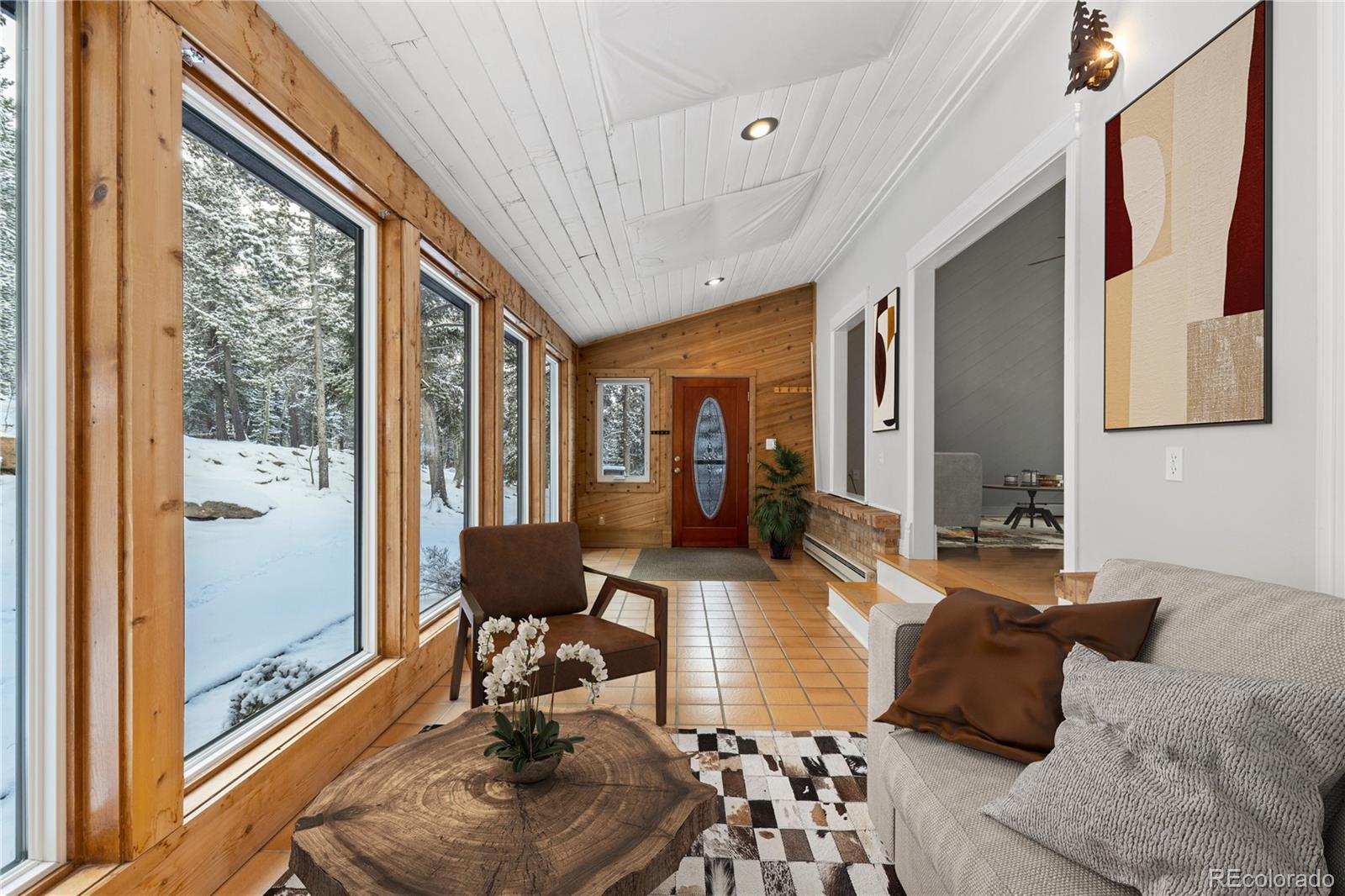 10684 Beas Drive Conifer, CO 80433 - Photo 14 of 38 a living room with furniture and a large window
