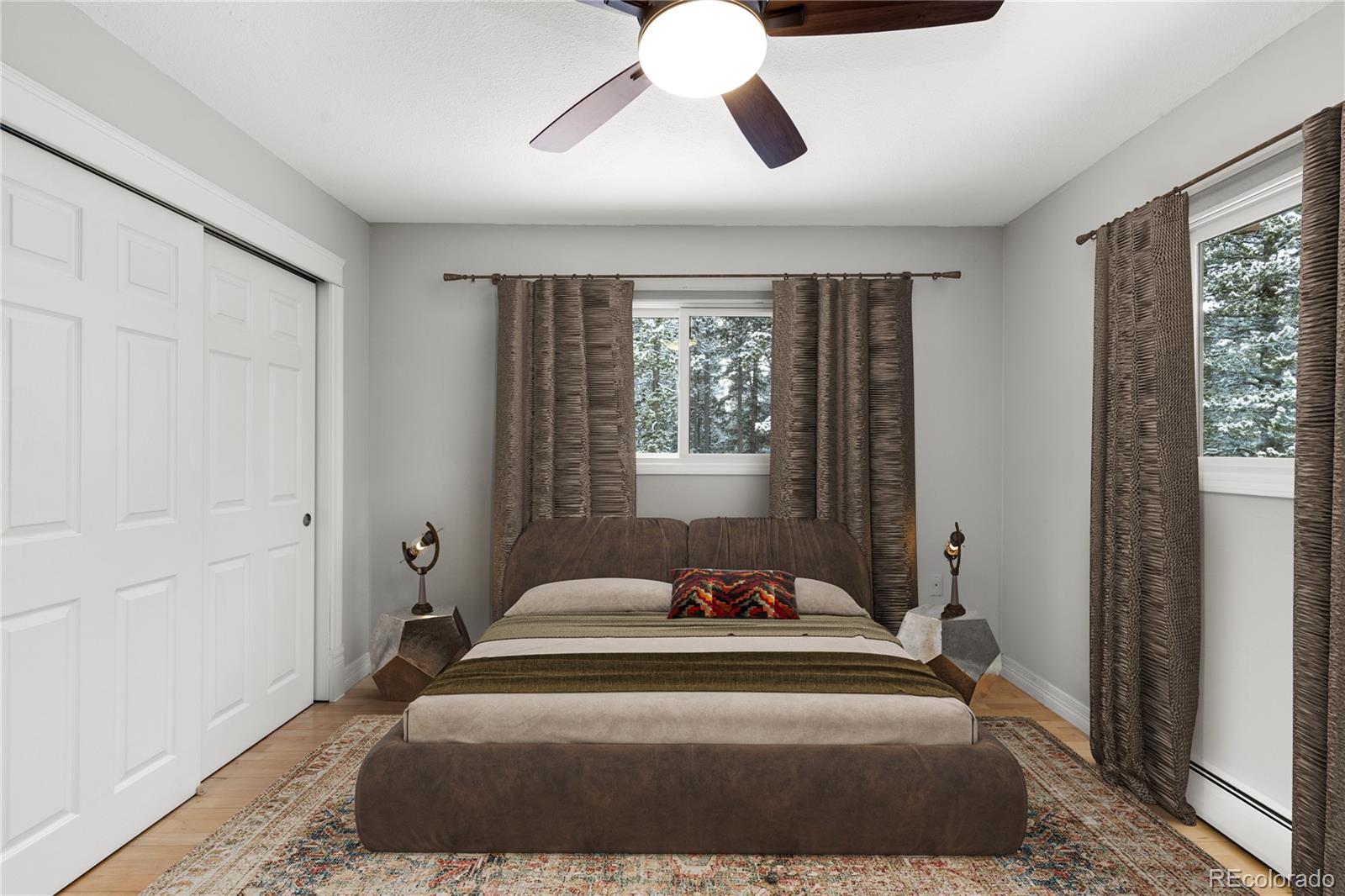 10684 Beas Drive Conifer, CO 80433 - Photo 16 of 38 a spacious bedroom with a bed and window