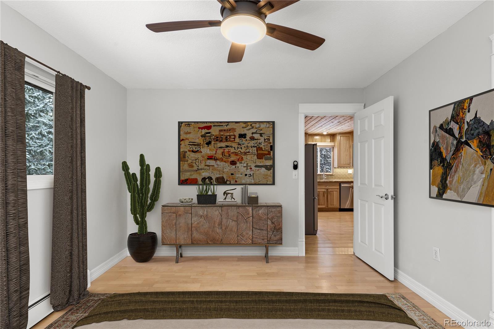 10684 Beas Drive Conifer, CO 80433 - Photo 17 of 38 a living room with furniture and a potted plant