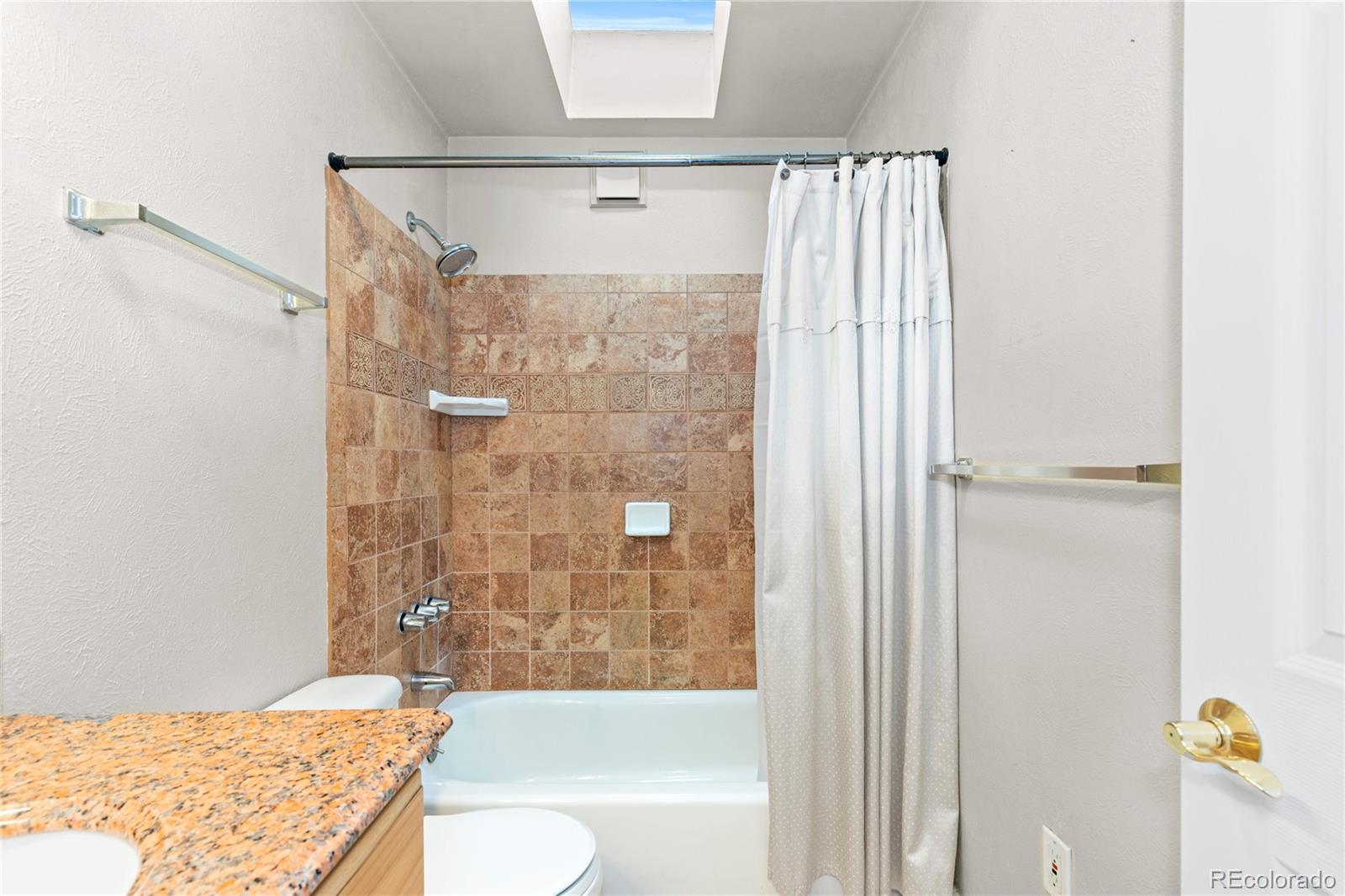 10684 Beas Drive Conifer, CO 80433 - Photo 25 of 38 a bathroom with a granite countertop sink toilet and shower