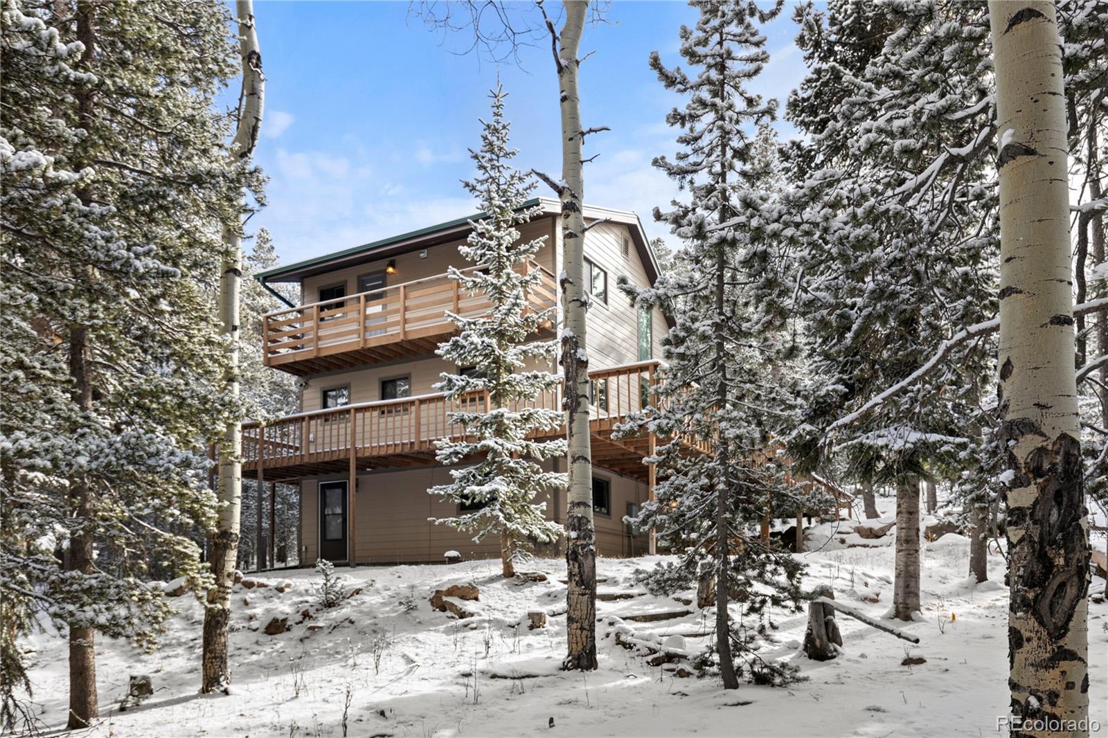 10684 Beas Drive Conifer, CO 80433 - Photo 30 of 38 a view of a house with a tree