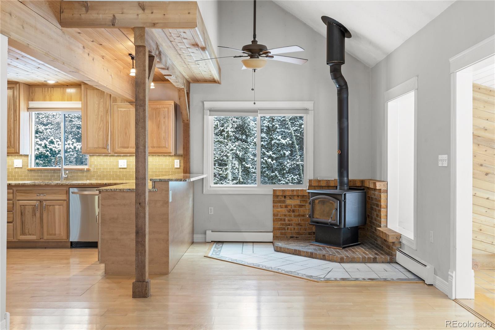 10684 Beas Drive Conifer, CO 80433 - Photo 6 of 38 a view of a kitchen with a sink and a stove top oven