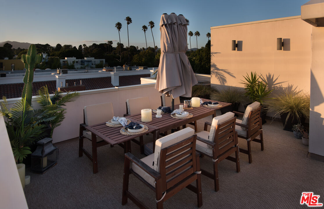 838 17th Street, Unit 105 Santa Monica, CA 90403 - Photo 7 of 10 a dining room with furniture and wooden floor