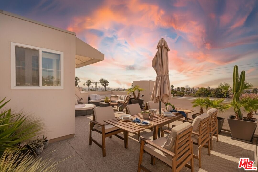 838 17th Street, Unit 105 Santa Monica, CA 90403 - Photo 8 of 10 a view of a terrace with furniture and sitting area