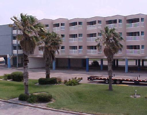 a front view of a building with garden
