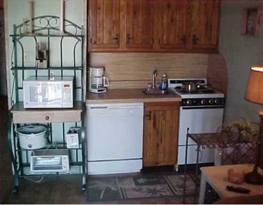 a kitchen with a stove and a cabinet
