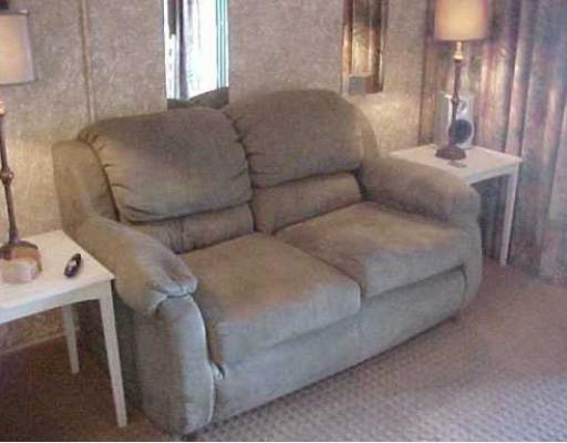 3938 Surfside, Unit 2223 2223 Corpus Christi, TX 78402 - Photo 4 of 9 a living room with furniture and a window