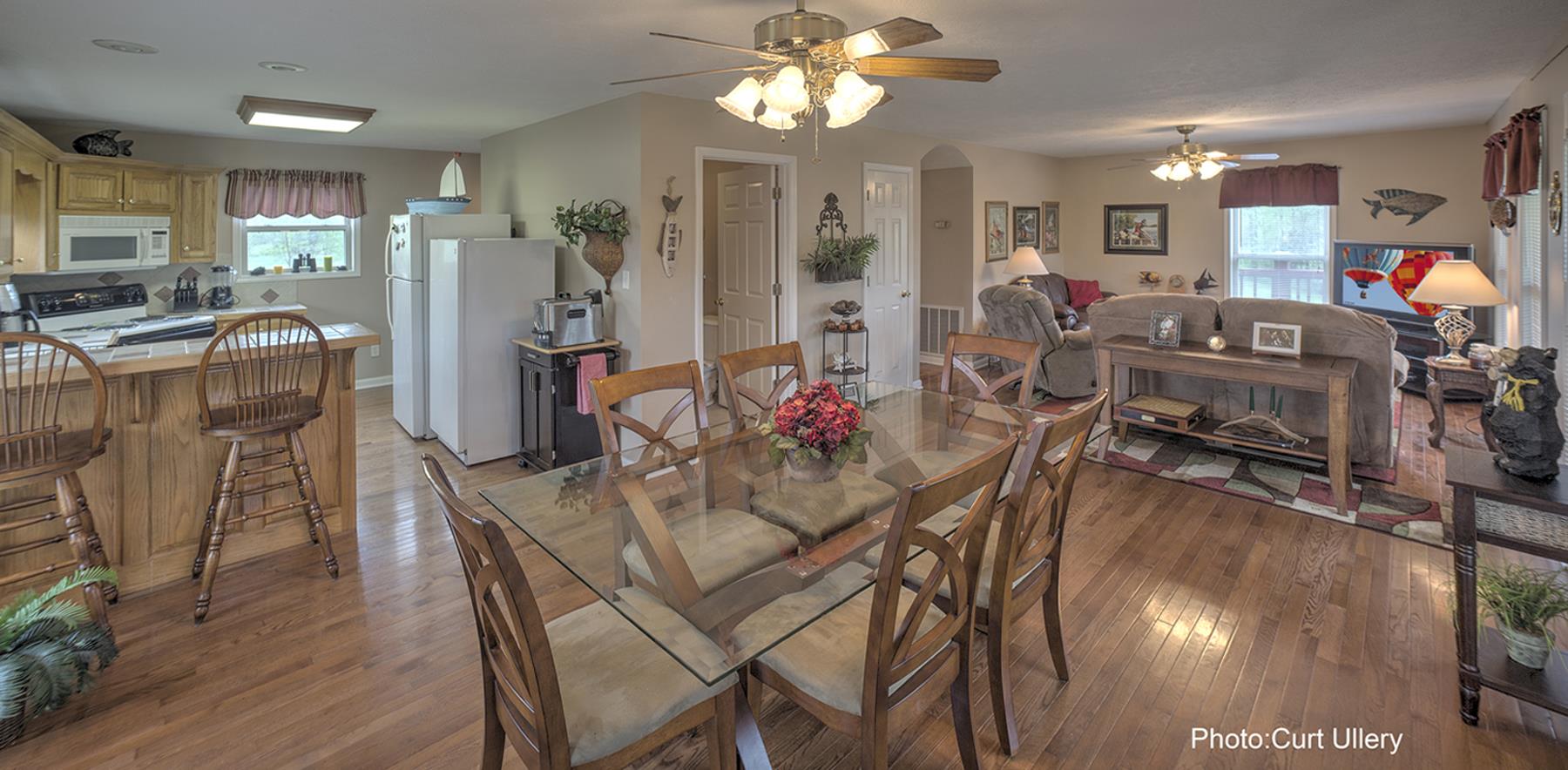 1385 Col James Hardin Road Clifton, TN 38425 - Photo 4 of 11 a view of a dining room with furniture and wooden floor