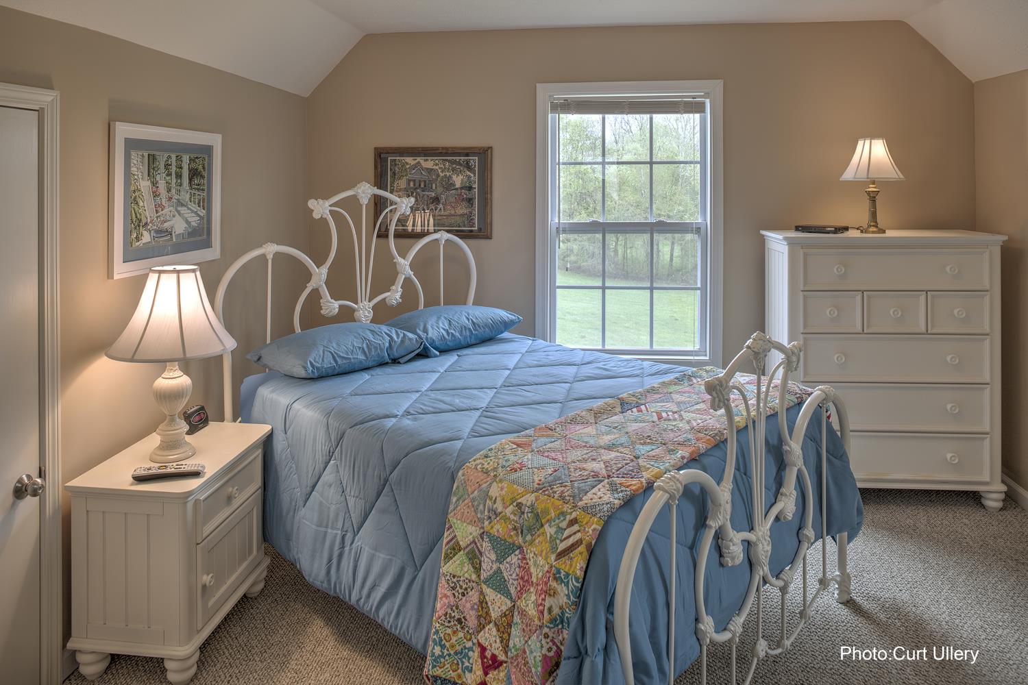1385 Col James Hardin Road Clifton, TN 38425 - Photo 8 of 11 a bedroom with a bed and a window
