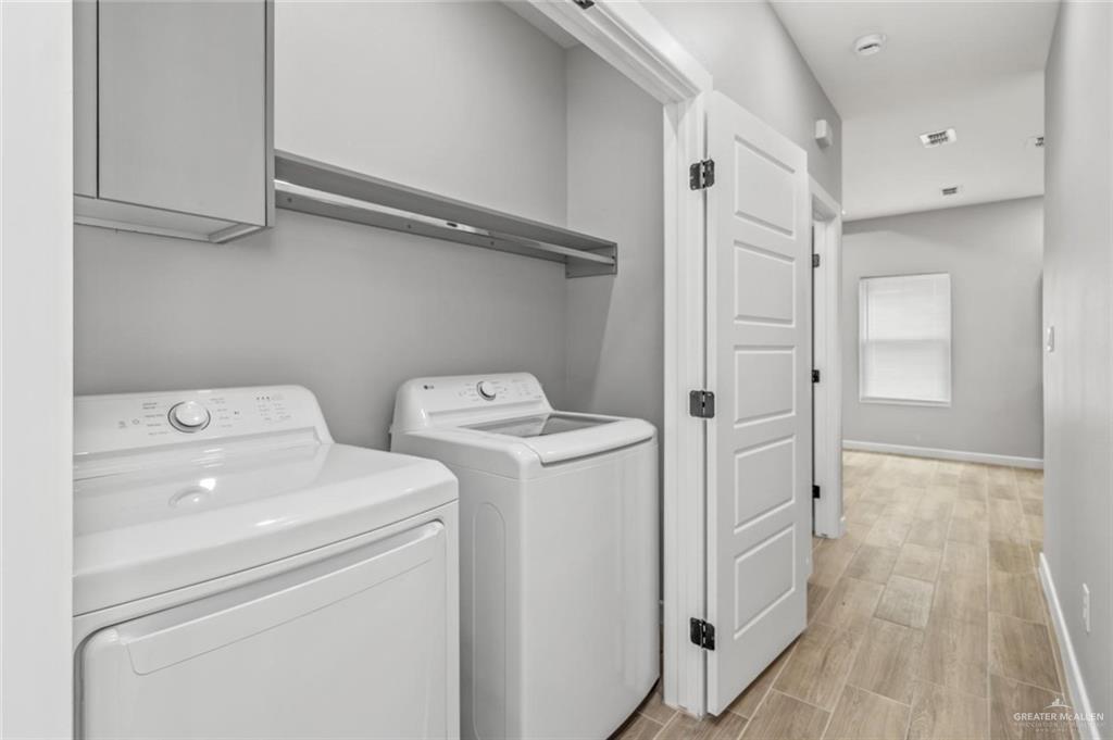 103 Yosemite Drive, Unit 3 Mission, TX 78572 - Photo 8 of 9 a view of storage and utility room with washer and dryer