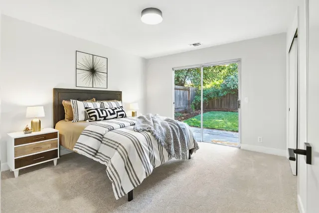 a bed room with a bed and a view