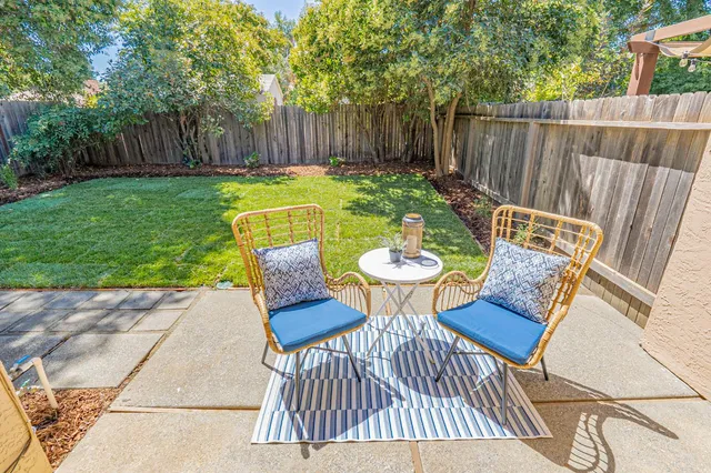 a view of a table and chairs on the deck