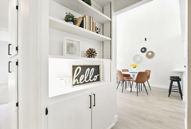 a view of a dining room with furniture and wooden floor