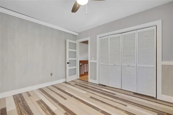 a view of a livingroom with wooden floor and white walls