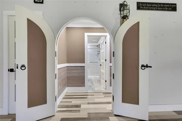 a view of a entryway door with wooden floor