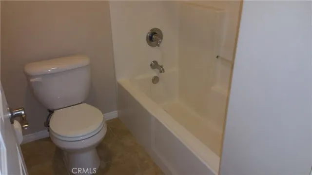 a potted plant sitting in front of a house