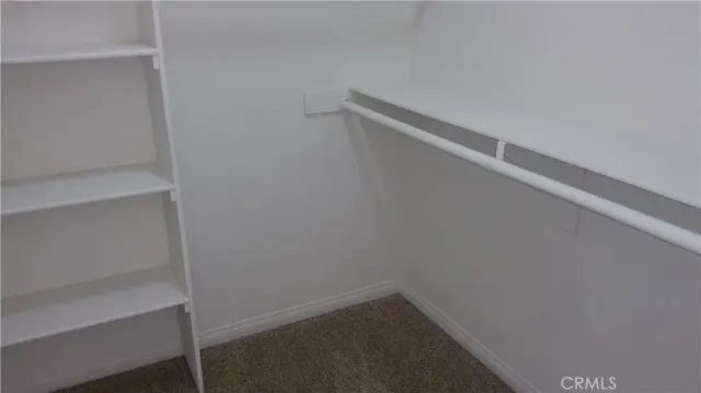 a front view of a residential apartment building with a yard