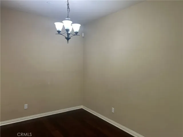 a kitchen with granite countertop a sink and steel appliances