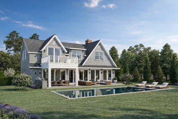 a front view of a house with swimming pool having outdoor seating
