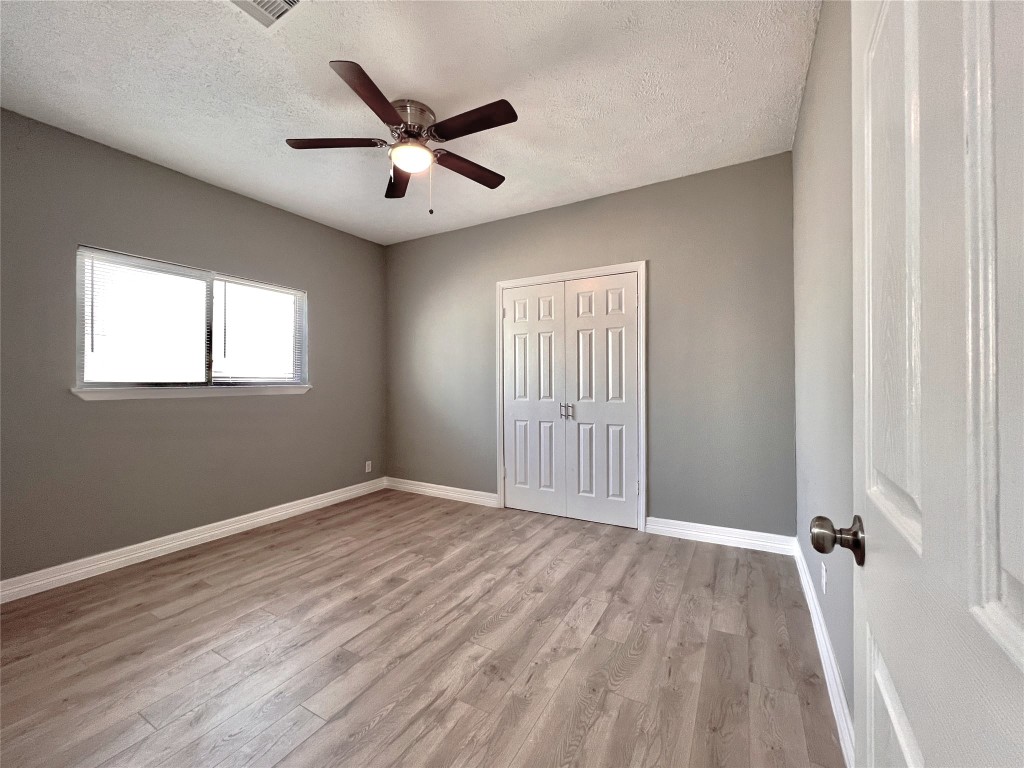 4106 Robertson Street Houston, TX 77009 - Photo 11 of 14 wooden floor in an empty room with a window