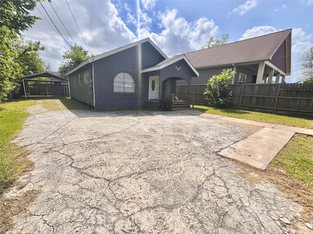 4106 Robertson Street Houston, TX 77009 - Photo 2 of 14 a front view of a house with a yard and garage