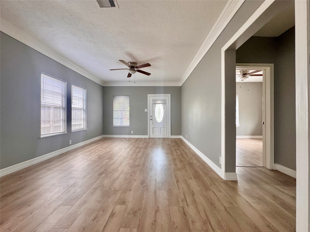4106 Robertson Street Houston, TX 77009 - Photo 5 of 14 a view of empty room with wooden floor and fan