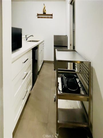 a kitchen with a stove and a microwave