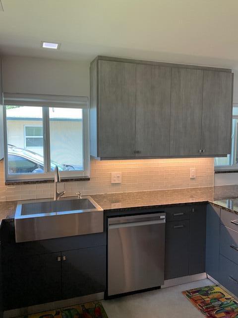 224 Cardinal Lane Delray Beach, FL 33445 - Photo 13 of 38 a kitchen with a sink and a window