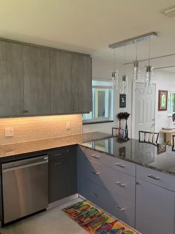 a kitchen with counter top space and sink