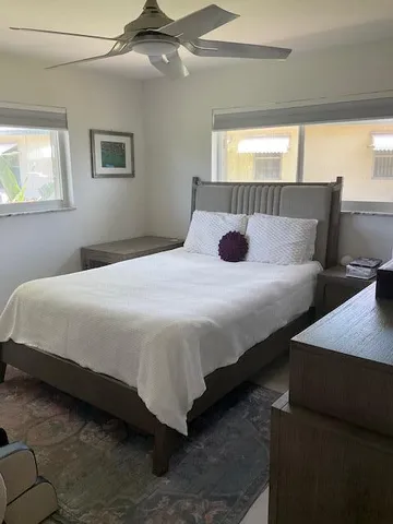 a spacious bathroom with a double vanity sink and a window