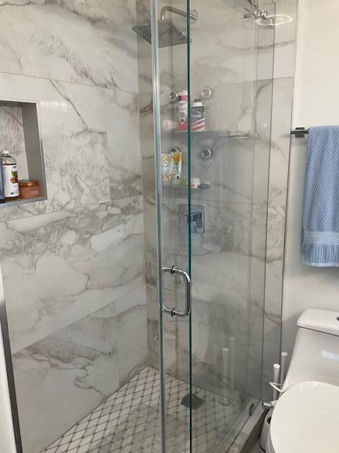 224 Cardinal Lane Delray Beach, FL 33445 - Photo 23 of 38 a bathroom with a shower and toilet