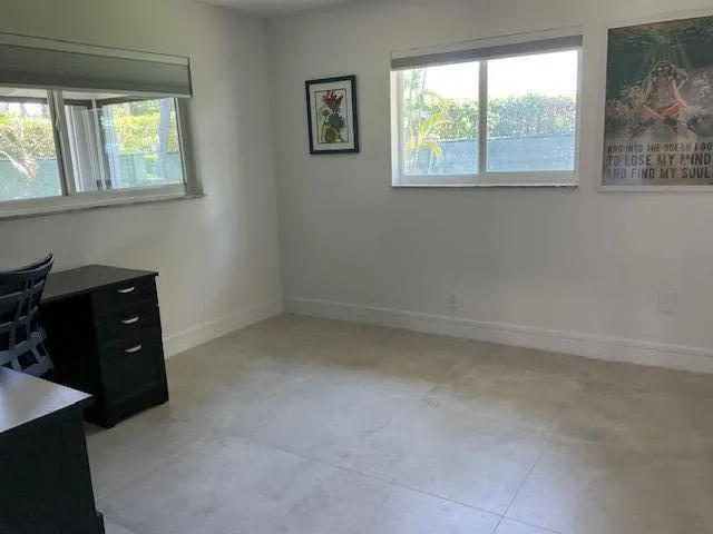 a room with furniture and a window