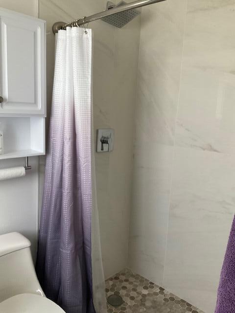 224 Cardinal Lane Delray Beach, FL 33445 - Photo 29 of 38 a bathroom with a sink and a toilet